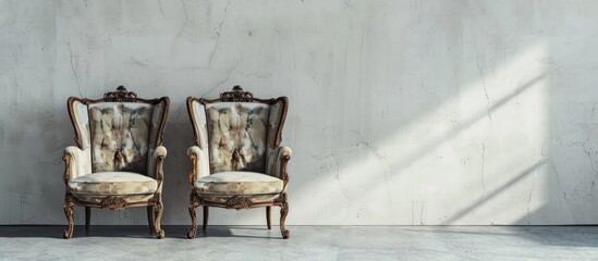 Poster - A pair of antique chairs placed on a plain concrete surface with copy space image