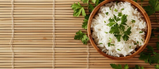 Poster - Top view of appetizing boiled rice bowls garnished with parsley on a bamboo mat suitable for adding text in the copy space image
