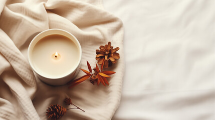 Wall Mural - Flat lay with fabric draping, fallen leaves and a beautiful candle on a white tabletop