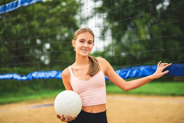 Wall Mural - teen play beach volleyball in summer season