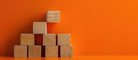 Poster - Message for going back to school displayed on wooden blocks against an orange backdrop serving as a symbolic representation with room for additional images
