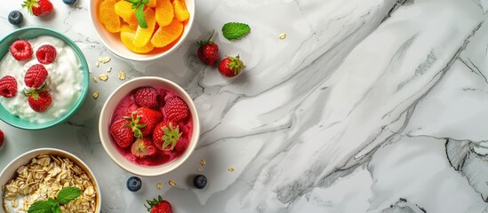 Aufkleber - Flat lay with breakfast bowls of fresh fruits yogurt porridge and whole strawberries on a marble table with copy space image