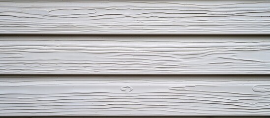 Wall Mural - Detailed close up shot of white vinyl siding exhibiting a realistic wood grain texture Background with a patterned frame provides ample copy space for text