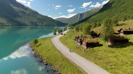 Wall Mural - explore lovatnet lake lodal valley, norways stunning beauty with green mountains, charming wooden bu