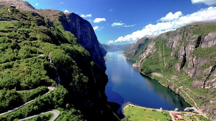 Wall Mural - Stunning aerial view of Lysefjord in Norway, showcasing its lush green cliffs and pristine waters. A perfect representation of Norways natural beauty