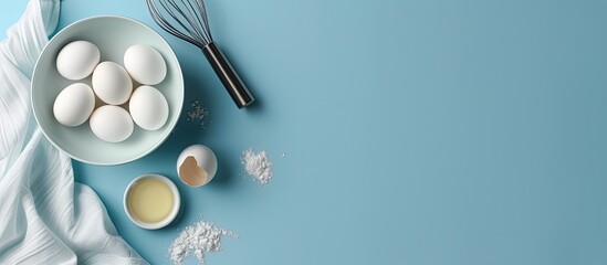 Aufkleber - Top view of a bowl eggs and whisk on a blue backdrop with room for text or other elements in the image Great for baking themed backgrounds. Creative banner. Copyspace image