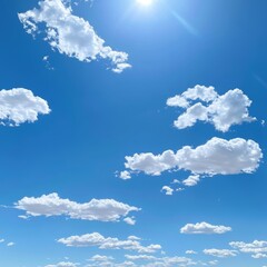 1. Clear blue sky with a few white clouds, serene weather, bright sunlight