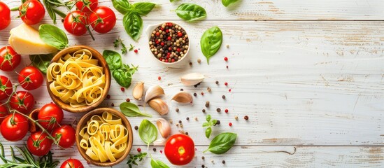 Poster - Italian ingredients for making pasta with vegetables spices and herbs displayed in a top view on a white wooden background ideal for an Italian healthy vegan meal with copy space image