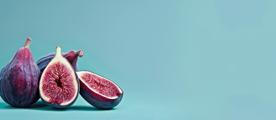 Poster - Ripe figs displayed on a blue backdrop with copy space image