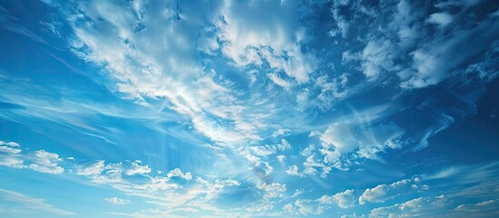 Aufkleber - Panoramic view of a serene clear blue sky with glowing cirrus clouds bathed in soft sunset light ideal for graphic design with ample copy space image symbolizing hope and peace in meteorology and hea