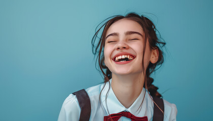 Poster - A woman is smiling and laughing in front of a red wall