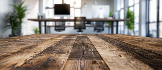 Poster - Ideal for showcasing office products a wooden table top amidst a blurred modern office background offers a versatile copy space image