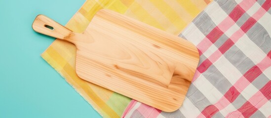 Wall Mural - Top view of a cutting board with a napkin on a colorful background perfect for copy space image