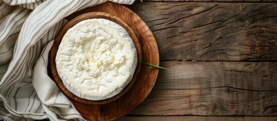 Aufkleber - Fresh soft cheese made from cow goat or sheep milk is a natural appetizer on a rustic table ideal for a meal or snack displayed with copy space in a top view food background