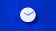 © Elshad Karimov - White analog clock on a light blue background. A large, royal blue circle on a dark royal blue background.