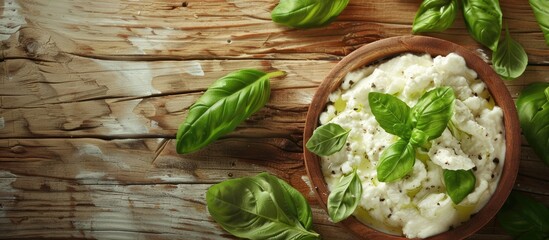 Poster - Wooden table with fresh ricotta and basil close up view for copy space image