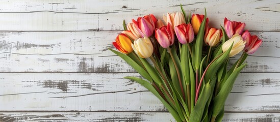 Poster - Vibrant tulip bunch displayed on weathered white wooden backdrop Ideal for Easter themed visuals with room for text or images. Creative banner. Copyspace image