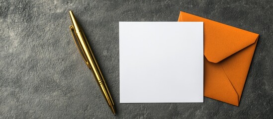 Poster - a blank white card beside a golden pen and an orange paper envelope. with copy space image. Place for adding text or design