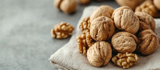 Leinwandbilder - A close up of numerous whole walnuts on a napkin Nutritious organic food rich in protein. with copy space image. Place for adding text or design