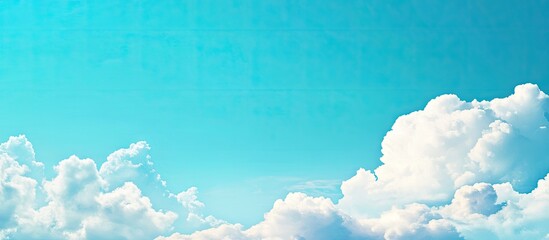 Wall Mural - Beautiful blue sky with white clouds a backdrop offering space for your own text. with copy space image. Place for adding text or design