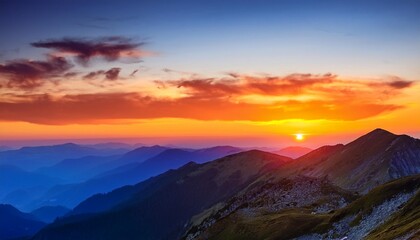 Wall Mural - sunset in the mountains with orange and blue colors