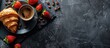 © vxnaghiyev - Espresso coffee cup and croissant with fresh strawberries on a black slate stone board against a dark background Top view copy space
