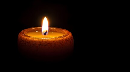 Poster - A single candle burning brightly in the midst of darkness its flickering flame casting a warm inviting glow and symbolizing the power of inner reflection