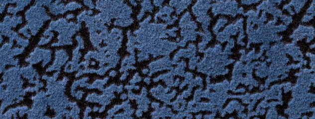 Blue and black background from soft upholstery textile material with wave abstract pattern