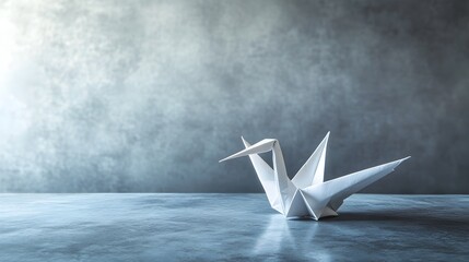 Poster - Elegant origami paper crane resting on a minimalist empty surface with ample copy space  Symbolic of Japanese tradition simplicity and grace
