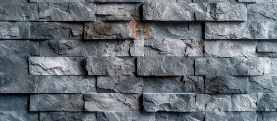 Poster - Gray seamless stone wall textured background featuring gray spots Concrete fence Empty studio background with concrete texture. with copy space image. Place for adding text or design