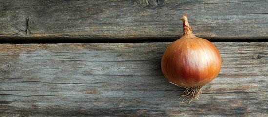 Poster - Close up of a Crimean sweet onion on an aged wooden surface Flat lay Top view Copyspace Selective focus