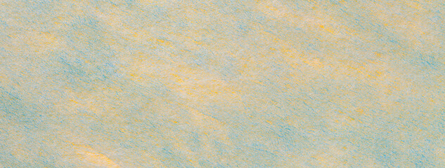 Wall Mural - Texture of light yellow and blue felt background with spots of fabric, macro. Structure of woolen textile