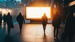 © яна винникова - Illuminated billboard in a bustling urban street during twilight. Advertising screen can be used for any advertisement. Blank for designers, mockup