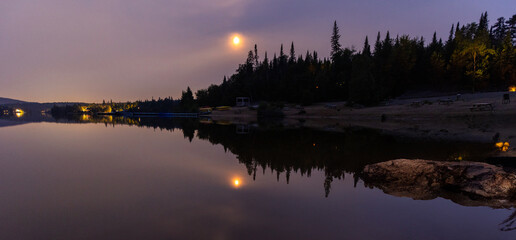 Wall Mural - full moon over the lake in mont tremblant national park, canada