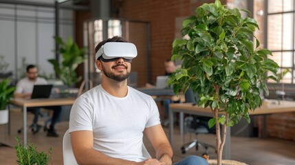 Wall Mural - In a contemporary office space, a man wears a VR headset, deeply engaged in a virtual experience, surrounded by focused colleagues working on various tasks.