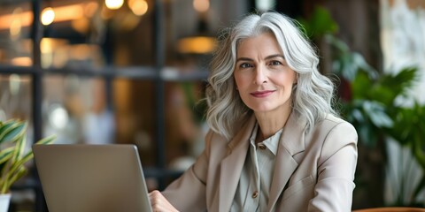 Sticker - A thoughtful and elegant grandmother using a laptop, reflecting her attractive and modern lifestyle.