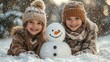 © asayenka - Two children are engaged in making a snowman on a sunny winter day.