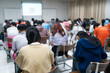 © EduLife Photos - Selective focused high school or university students are intently writing on their answer sheets during a final exam in the classroom.