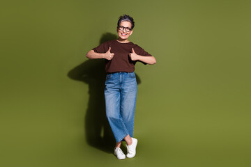 Sticker - Full size photo of nice aged woman thumb up empty space wear t-shirt isolated on khaki color background