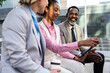 © oneinchpunch - Group of multiethnic business people meeting outdoors during lunch pause from work - International corporate business team bonding in the city and looking at tablet device