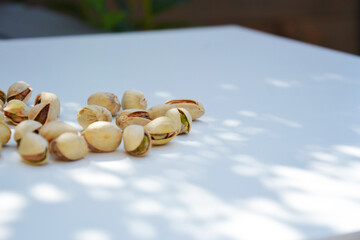 tasty pistachios in shells on white background