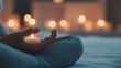 © Khritthithat - A person meditating in bed with soft light and a calming atmosphere, representing mindfulness as part of a sleep routine