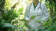© Premreuthai - A doctor in a white coat stands among lush greenery, symbolizing health and nature's healing power.