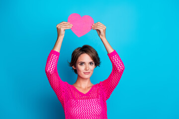 Wall Mural - Photo of funky cheerful woman wear knitted neon shirt rising pink heart postcard isolated blue color background