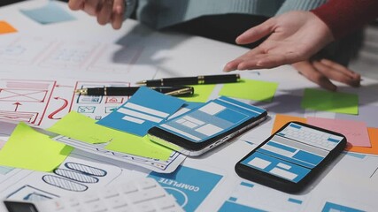 The designer team is designing the uxui system to make the uxui system work well on new phones and support system updates. Website development concept UI UX front end designer