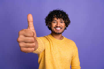 Sticker - Photo of cheerful funny man wear trendy yellow clothes thumb up isolated on violet color background