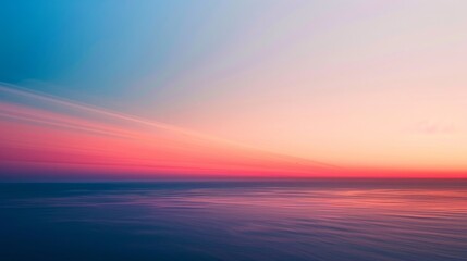 Aufkleber - A stunning gradient of sunset colors spreads across the sky, with deep reds and soft pinks blending seamlessly into the twilight blue.