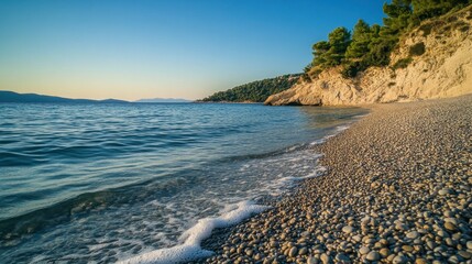 Wall Mural - Tranquil Pebble Beach with Clear Blue Waters