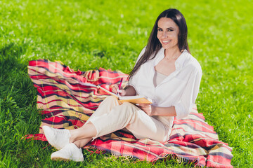 Poster - Full body photo of young cheerful woman sit picnic blanket write diary wear white outfit walk park sunny summer weather outside