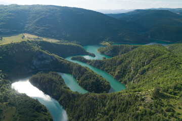 aerial view of a picturesque river meandering among the hills